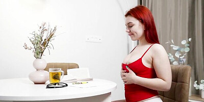 Impressive redhead Fessa Lux shows off her naked body