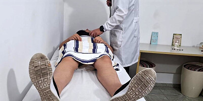 Medical exam of the patient's stomach in the therapist's office.
