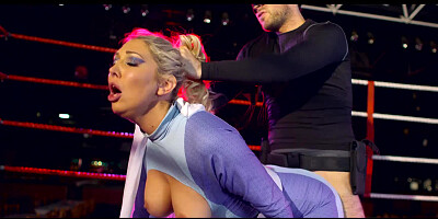 A babe with large tits is getting her hair pulled in the ring