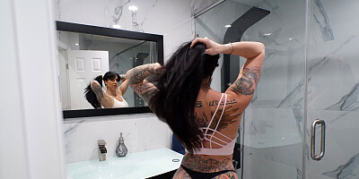 Inked brunette blows a masseur and gets fucked hard