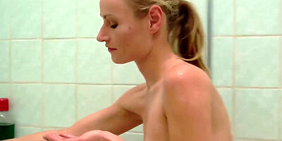 Beautiful blonde caresses her pussy in the shower