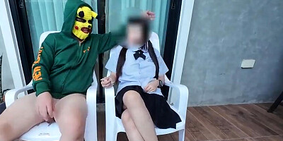 Thai students having outdoor bang-out with a pal.