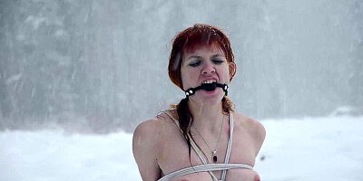 Naked barefoot Greta tied up in the snow