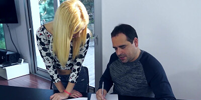 Cute blonde is pressed against the desk where she receives love