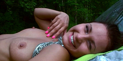 A brunette with natural boobs gets touched and licked by her man