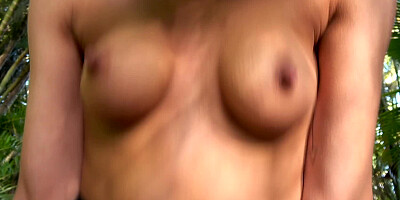 Adorable girlfriend services her man near his car in the forest