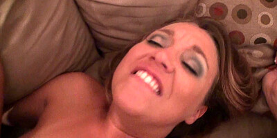A blonde with a nice set of boobs is fucked on the sofa with her friend