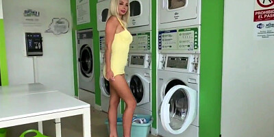 German blonde masturbates at a public laundry