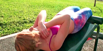 Pretty lady stretches her sexy body outside on a hot day