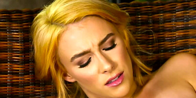 Sweet blonde girl is playing with herself in the yard