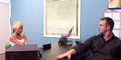 A blonde with small tits is getting fucked on the desk in an office
