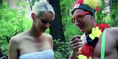 Short-haired blonde girl is sucking some cock in the woods