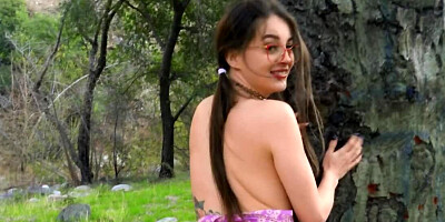 Cute teen brunette with glasses enjoys outdoor cowgirl riding