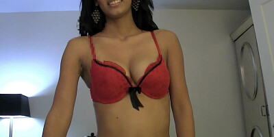 A Latina undresses herself and then she sits on a large cock