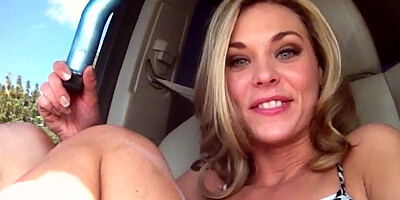 Solo girl plays with her pussy in the back seat of the car