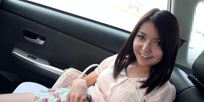 Pretty Japanese girl plays with purple vibrator in the back seat