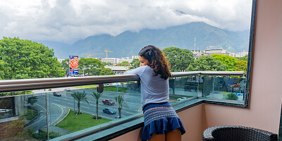 Ligia Margarita spreads in the chair and plays with wet pussy