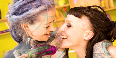 Inked girl drills her lesbian girlfriend with a big dildo