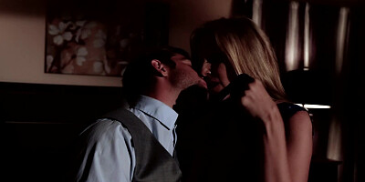 A blonde is having a romantic dinner with her lover in the dark