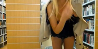 Great looking blondie disrobing and flashing boobs in library