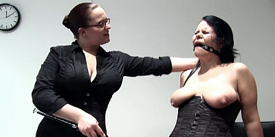 Woman nails brunette's pussy with her fist