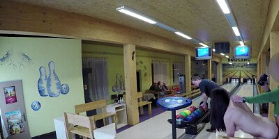 Guy is playing bowling while another man is fucking his chick