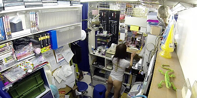 Horny minx from Japan masturbates pussy in sex shop storeroom