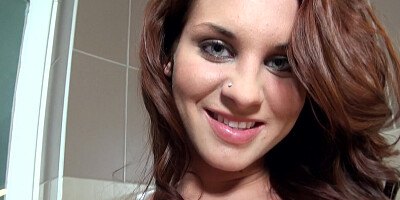 A brunette solo girl is fooling around in the shower by herself
