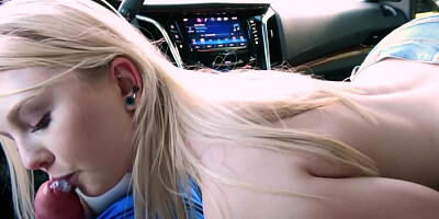 Slutty blonde is sucking boyfriend's dick in the car