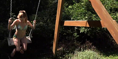 Hot babe sticks dildo into her wet cunt on the grass