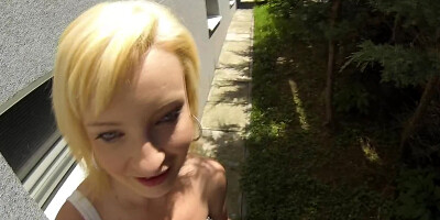 Amateur blonde is sucking stranger's dick on the street