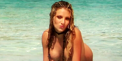Sensuous sweetie masturbates in water near the lonely beach