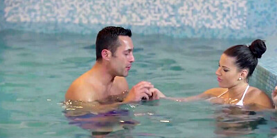 Elegant brunette has foreplay in the pool before sex