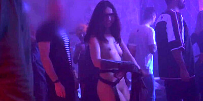 Kinky gal flashes bare pussy and tits in the nightclub