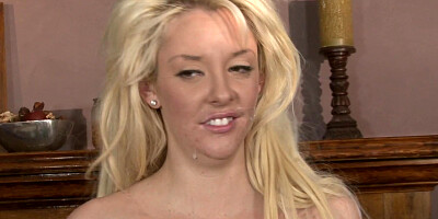 A blonde with big tits is getting a facial from her boyfriend