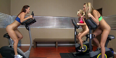 Trio of hot bitches is shown fucking each other in the gym