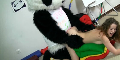 A dude in a panda suit is penetrating a curly teen slut