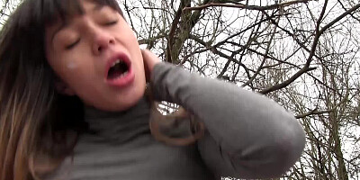 A lovely amateur is spreading her legs in the forest for her partner