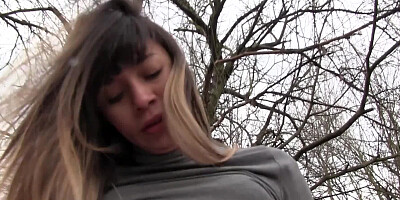 A lovely amateur is spreading her legs in the forest for her partner