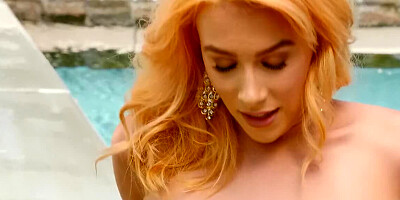 Gorgeous naked blonde is masturbating by the swimming pool