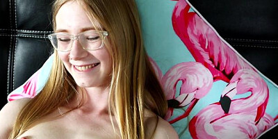 Petite Nymphet in a dress playing with toys