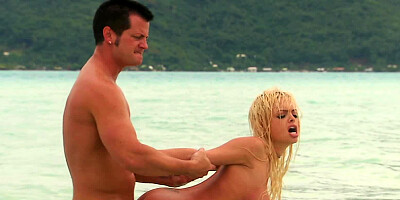 A blonde is by the lake and she is getting fucked there by her man