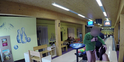 Petite brunette gal sucking a cock in the bowling alley