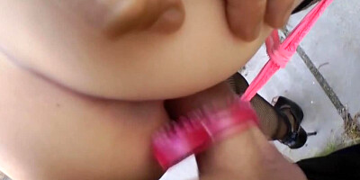 A gorgeous woman exposes her body in public and sits on a dick