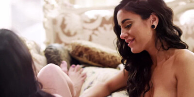 Winsome brunettes passionately caress one another on floor