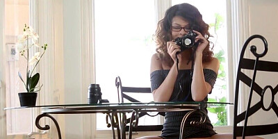 Redhead with big boobs is spreading her long legs