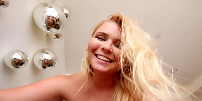 A blonde with a massive ass is sitting on a large hard cock