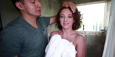 All-natural curly brunette sucks a big cock in the shower