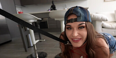 Chesty babe with leash on her neck obediently sucks stud's dick