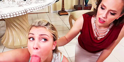 Two women are having some fun in a threesome